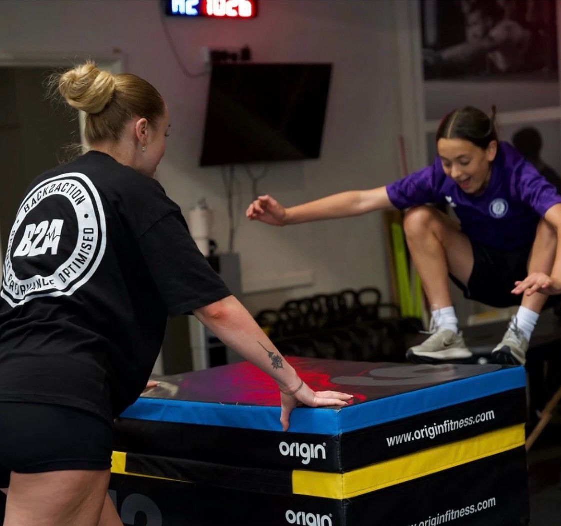 A Back2Action coach training a young athlete inside the Bristol performance hub